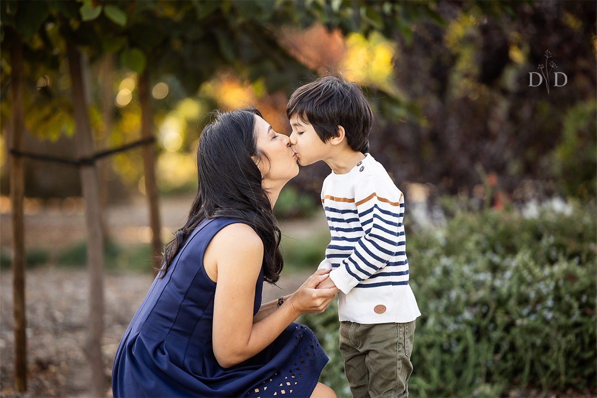 Sweet kiss between mommy and son