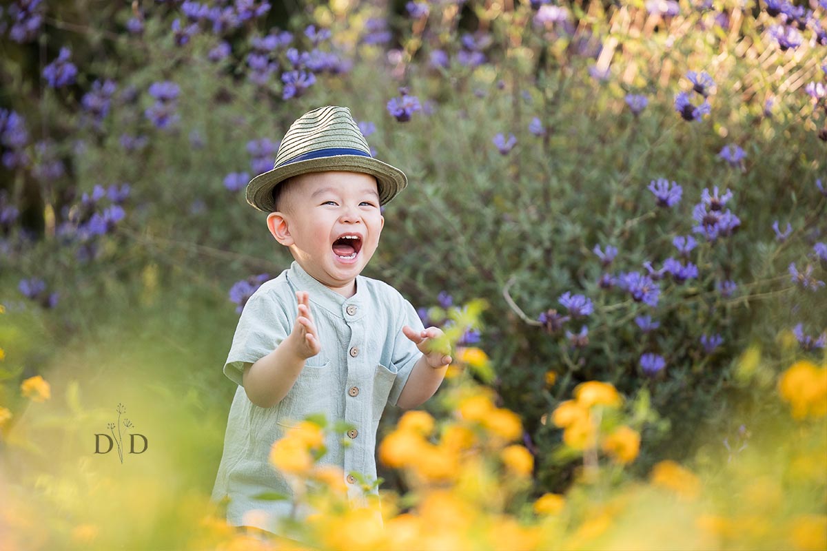 Laughing and Happy Child with Yellow Flowers