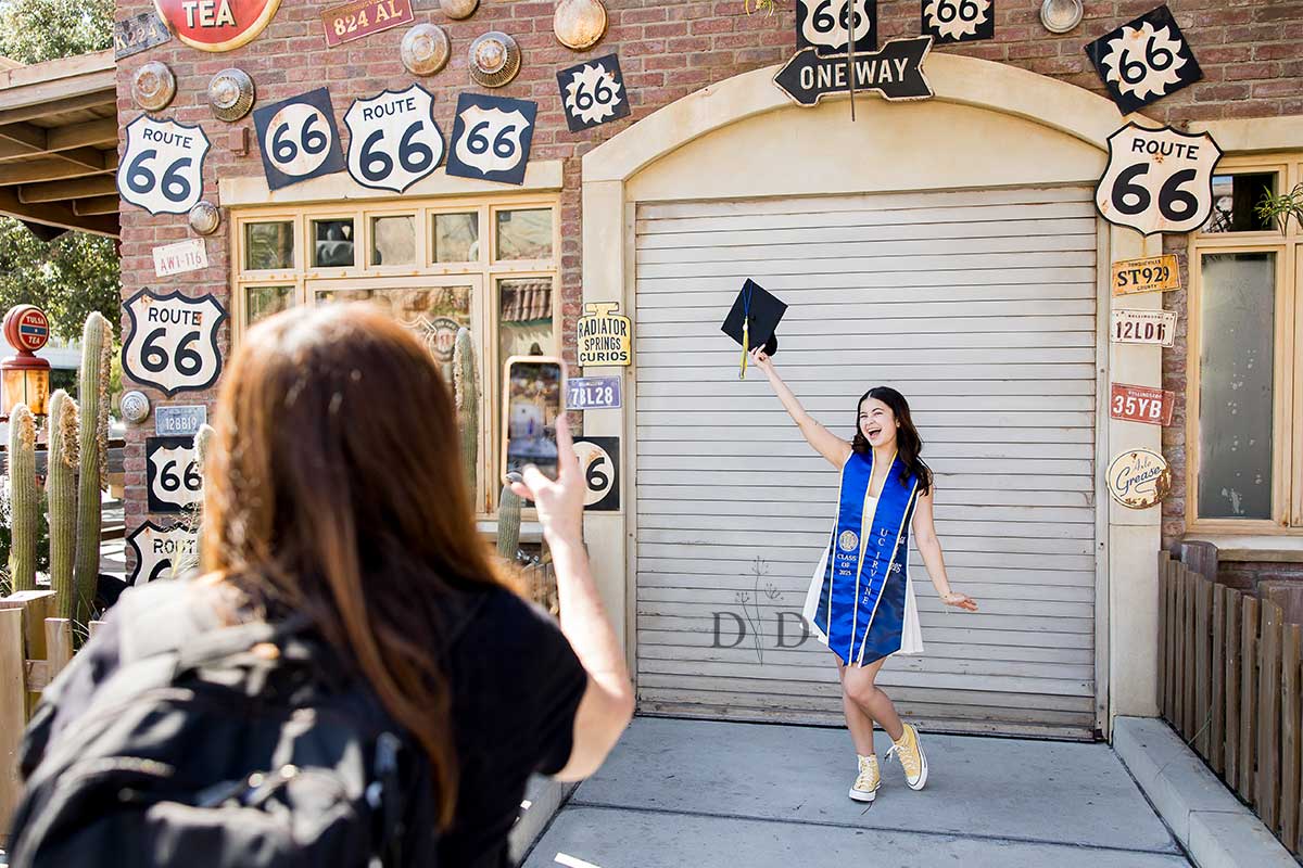 Proud mom taking a pic of her daughter