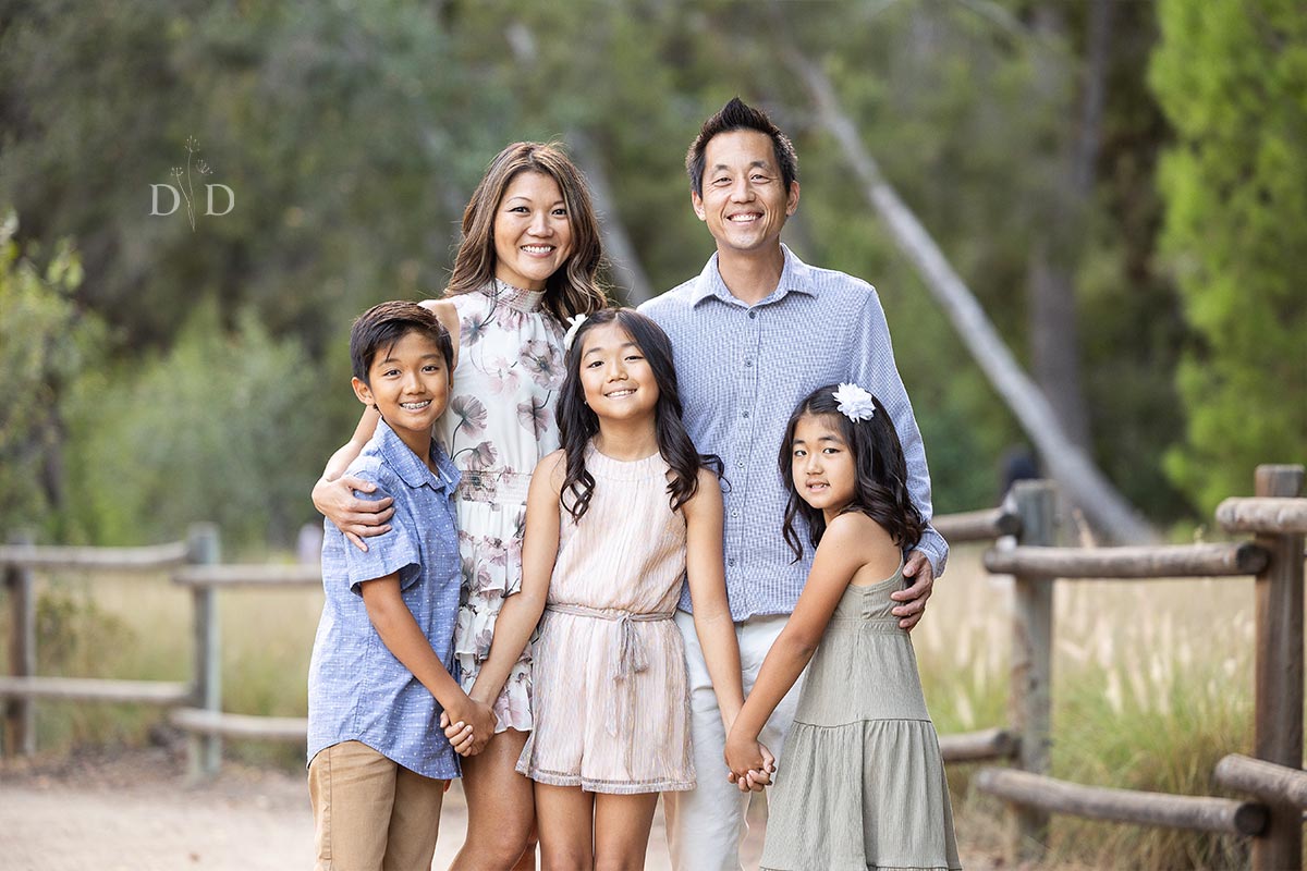Family photos next to a wooden fence