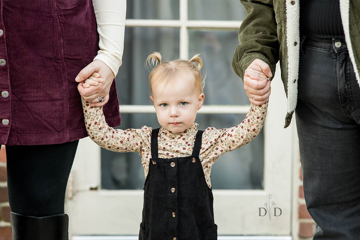 Their daughter in overalls